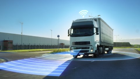 Futuristic High-Tech Concept: Big Autonomous Semi-Truck with Cargo Trailer Drives on the Road with Concept Sensors Scanning.Graphics, Special Effects of Futuristic Self Driving Truck Analyzing Freeway