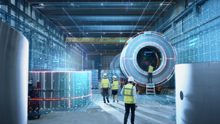 Futuristic Technology Concept: Team of Engineers and Professionals Workers in Heavy Industry Manufacturing Factory that is Digitalized with Graphics into Digital Twin of Industry 4.0 High Tech | Shutterstock HD Video #1060479184