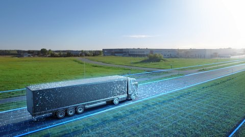 Futuristic High-Tech Concept: Big Semi Truck with Cargo Trailer Drives on the Road is Transformed with Graphics Special Effects Into Digitalized Advanced Autonomous Truck Concept. Aerial Drone Shot