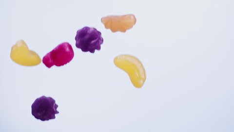 Falling Fruit candy's  on blue background  super slow motion 1000 fps
