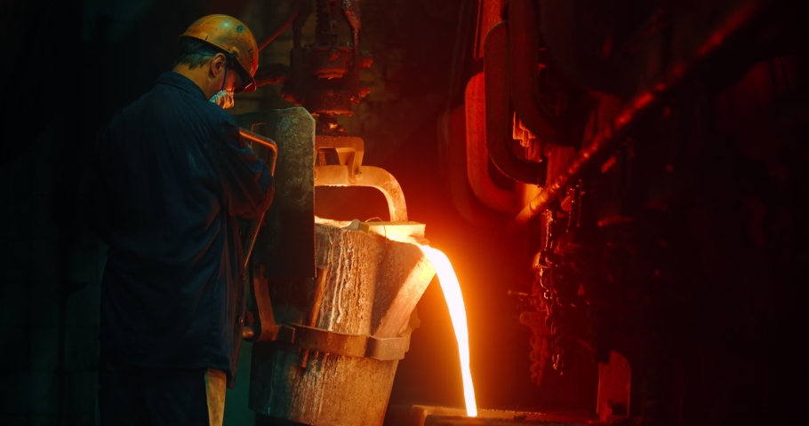The worker pours in the form of hot metal. Metalworks Royalty-Free Stock Footage #1060484158