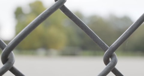 Metal chain link fence - close up withh ing background