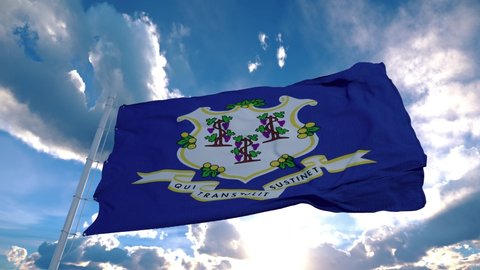 Connecticut flag on a flagpole waving in the wind in the sky. State of Connecticut in The United States of America