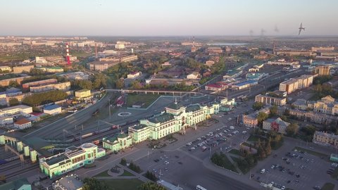 D-Cinelike. Russia, Omsk - July 16, 2018: The central railway station of the city of Omsk. The building of the station. Sunset, Aerial View