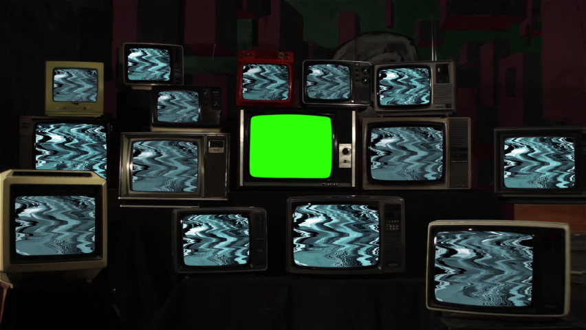 Stack of Old Television Sets with Glitch Pattern and One TV Green Screen. You can replace green screen with the footage or picture you want. You can do it with “Keying” effect in After Effects. | Shutterstock HD Video #1060514848