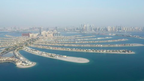 Aerial view of branches of Palm Jumeirah man-made islands in Dubai, United Arab Emirates (UAE) with luxury hotels, residences and tourist attractions