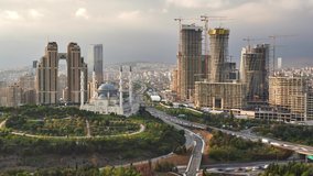 Panorama cityscape from Atasehir region of Istanbul, Turkey. Time lapse clip contains traffic of cars, construction of buildings, cranes at sunset time. 