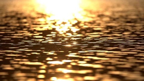 Reflection of sunlight over lake surface in slow motion