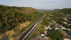 Bluffs next to a road in Red wing Minnesota during summer time aerial footage