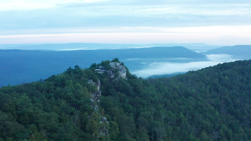 An aerial shot (clockwise orbit) of Big Schloss and the Trout Run Valley at dawn in the summer, located on the Virginia/West Virginia Border within the George Washington National Forest