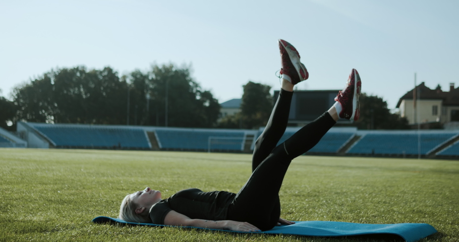 Leg raise abs workout. Morning  workout at stadium. 