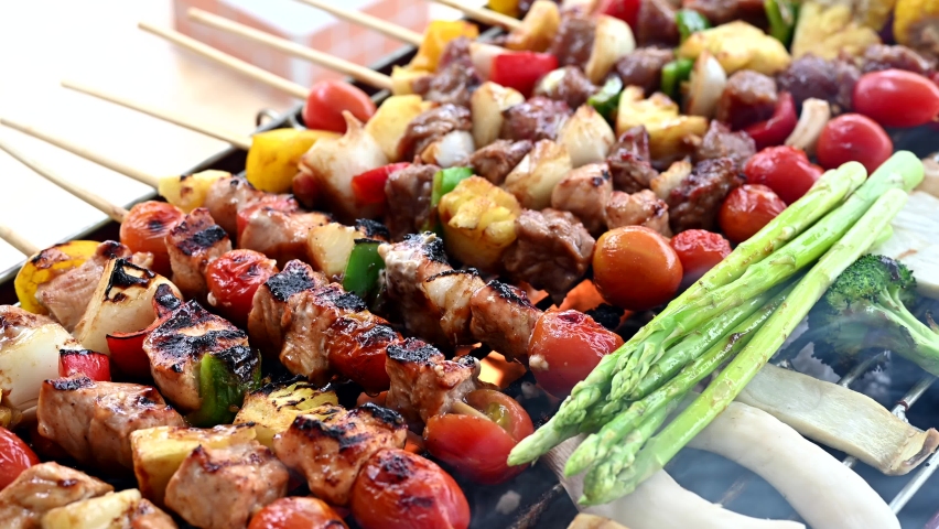 Grill and Barbecue party at home. Cooking BBQ pork, beef, chicken, seafood and vegetables. Family lifestyle and friend outdoor activity. | Shutterstock HD Video #1060540213
