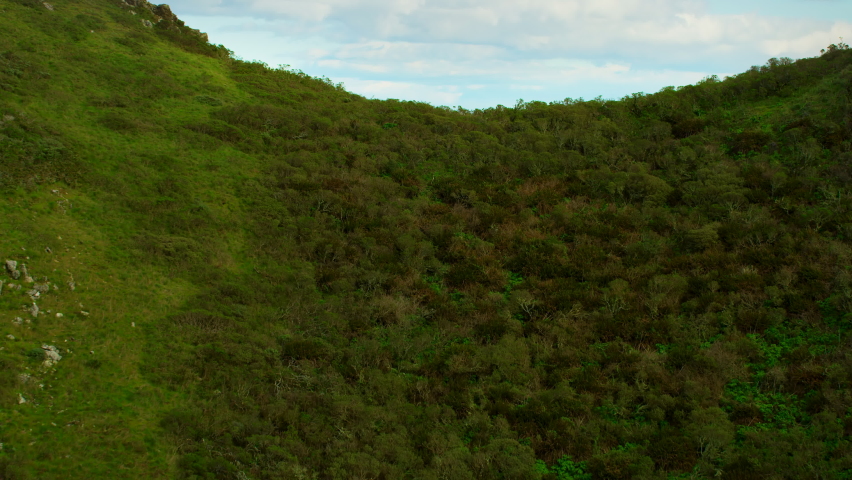 Flying over the Marin Headlands to discover the Golden Gate Bridge. San Francisco, US. This suspension bridge is one of the most iconic landmarks of California. Shot on Red weapon 8K.