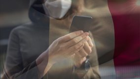 Animation of French flag waving over Caucasian woman wearing a face mask, using a smartphone. Covid-19 coronavirus national health safety concept digital composite - Powered by Shutterstock - Get 15% off with code: PIKWIZARD15