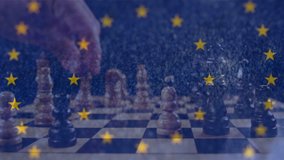 Animation of spinning European Union flag with yellow stars over person playing chess on blue background. European community economy concept digitally generated image. - Powered by Shutterstock - Get 15% off with code: PIKWIZARD15