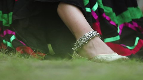 closeup shot of women feet with anklets.
