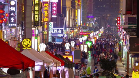 QINGDAO, CHINA - SEPTEMBER 16 2019: qingdao city famous night market pedestrian crowded street timelapse panorama 4k circa september 16 2019 qingdao, china.