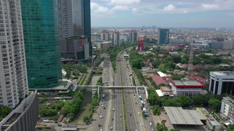 JAKARTA, INDONESIA - JANUARY 22 2020: city sunny day downtown traffic street road aerial topdown panorama 4k circa january 22 2020 jakarta, indonesia.