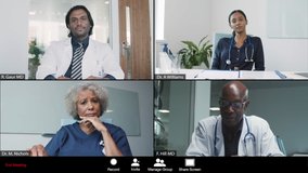 Middle Aged Male Doctor Leading Video Conference with Colleagues