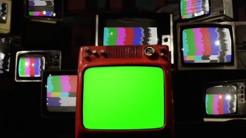 Stack of Old TVs with Color Bars and Retro Red TV with Green Screen. Zoom In. You can replace green screen with the footage or picture you want. You can do it with “Keying” effect in After Effects.