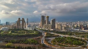 Panorama cityscape time lapse from Atasehir region of Istanbul, Turkey. Clip contains traffic of cars, construction of buildings, cranes at sunset time. 