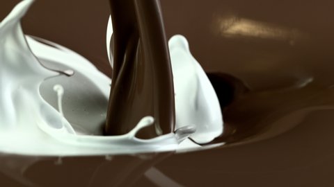 Super slow motion of mixing milk with molten chocolate. Filmed on high speed cinema camera, 1000 fps.