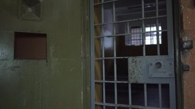 Prison Metal Door Closes Protect Prisoner From Inside to Escape. Food Channel Through Prison Cells Bars. Jail, Detail of Confinement and Crime, Justice. Prison Interior. - Powered by Shutterstock - Get 15% off with code: PIKWIZARD15