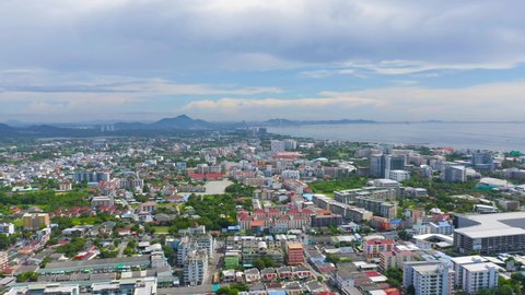 Aerial view of residential buildings in Sri Racha district with sea, Chonburi skyline, Thailand. Urban city in Asia. Architecture landscape background.