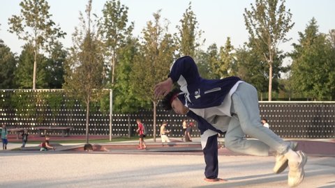 Male teenager dancing breakdance. Concept of youth street hip-hop culture
