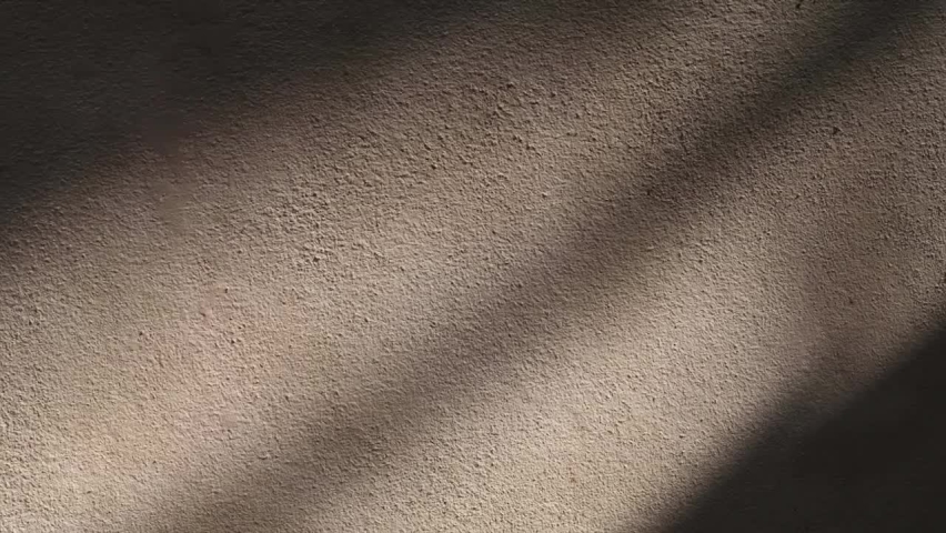 Sunlight shadow drop on old concrete cement wall or dirty grunge & rough floor of industrial construction building with silhouette black shade in tropical summer sun ray, Cinemagraphs B-roll TimeLapse Royalty-Free Stock Footage #1060599391