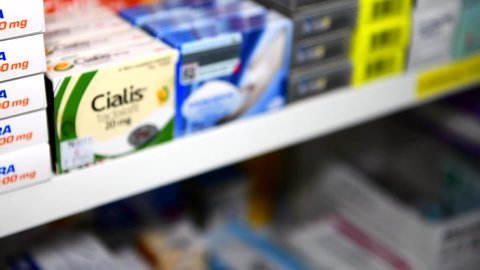BANGKOK ,THAILAND - OCT 14,2020 : Cialis packaging in hand at drugstore Bangkok. Cialis was originally developed by Eli Lilly as an erectile dysfunction drug
