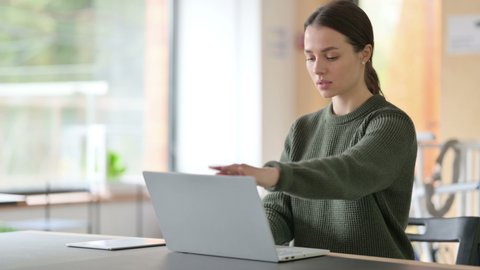 Young Woman Closing Laptop and Leaving 