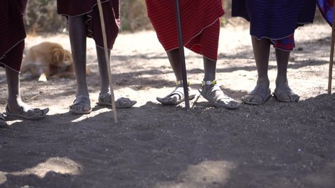 Tarangire / Tanzania - 08 31 2019: Slow Motion Close up of Feets of African Maasai Tribe Man Members While One Performing Jumping Dance