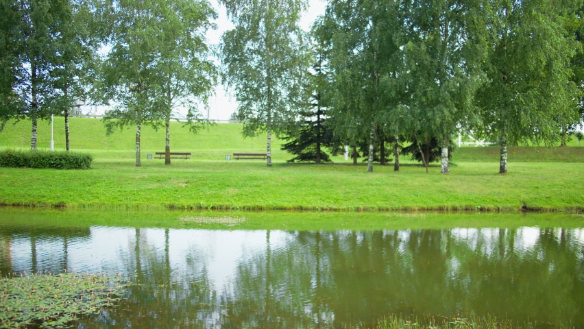 A lone cyclist rides through a deserted city park