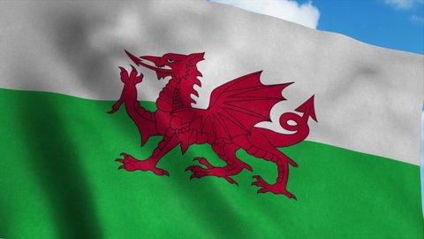 Wales flag waving in the wind, blue sky background. 4K