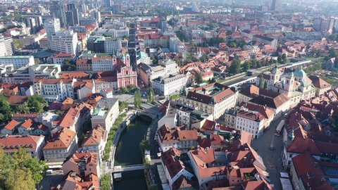 Panoramic aerial view of Ljubljana cityscape on banks of river Ljubljanica in sunny autumn morning, Slovenia. High quality 4k footage