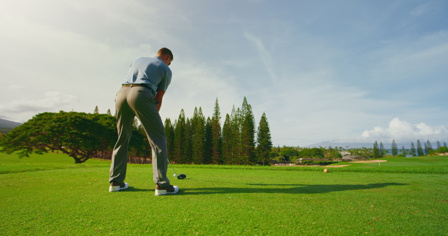 Sunrise golf, man swinging and hitting golf ball in slow motion | Shutterstock HD Video #1060634896