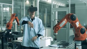 Male analyst in VR-glasses is managing a robotic mechanism. - Powered by Shutterstock - Get 15% off with code: PIKWIZARD15