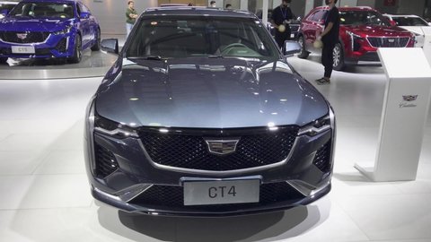 Shanghai, China - Sep 30, 2020: Cadillac booth showroom in Shanghai Pudong International Auto Show. Car exhibition and vehicle promotion. Auto business and economy staff with mask coronavirus period