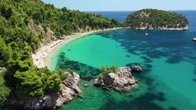 Aerial drone video of beautiful turquoise sandy beach of Stafilos, Skopleos island, Sporades, Greece 