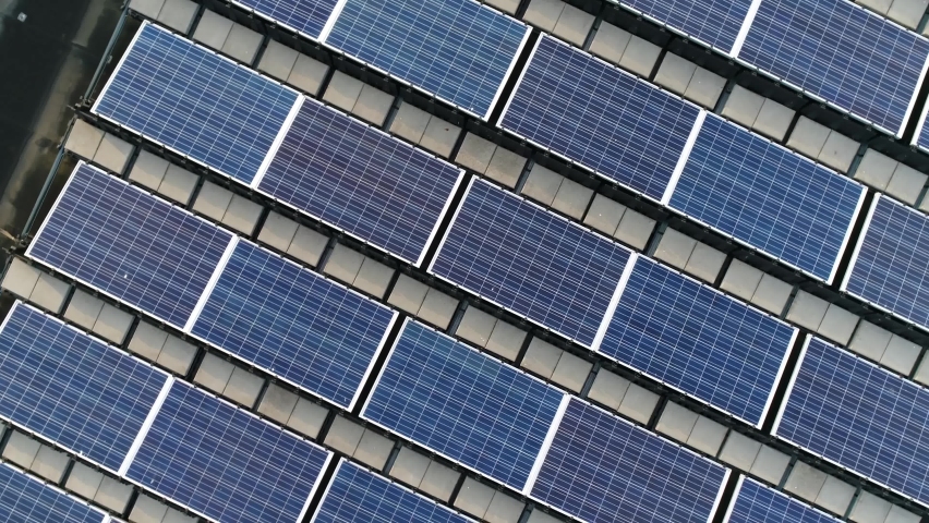Aerial top down view moving up above solar panels Royalty-Free Stock Footage #1060643278