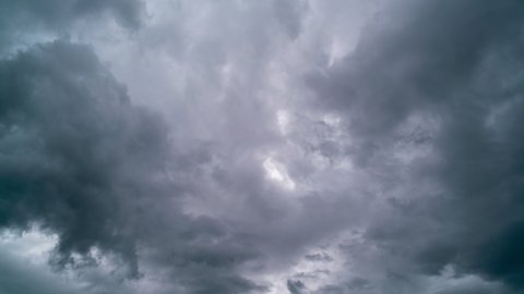 Time lapse 4K of moving dark rain storm clouds flowing in the sky in bad weather day,Horrible weather
