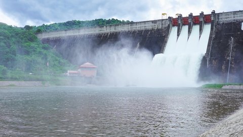 Hydroelectric dam Floodgate with flowing water through gate and Open the springway Khun Dan Prakan Chon Dam in nakhon nayok Thailand