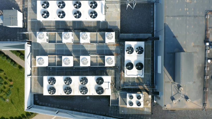 Heating, ventilation and air conditioning systems installed on the rooftop. Aerial top down view Royalty-Free Stock Footage #1060651081