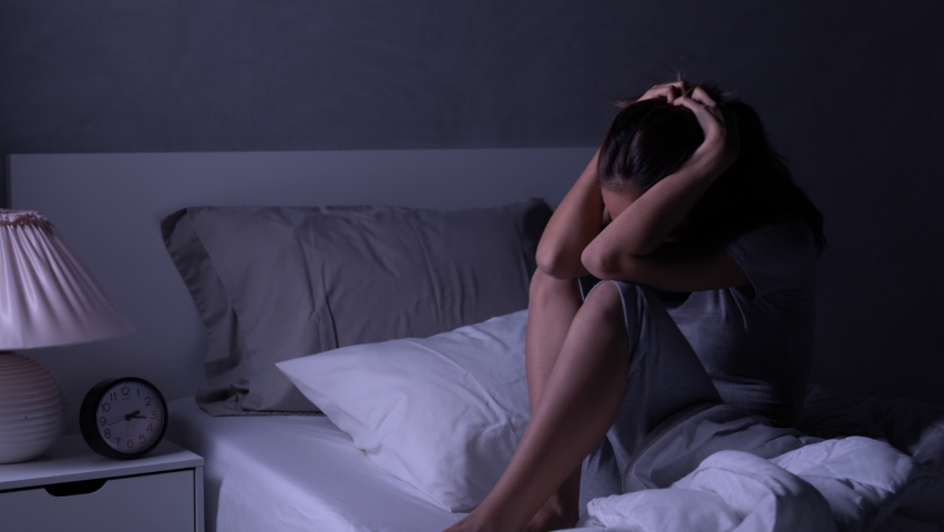 Depressed young Asian woman cannot sleep from insomnia. Depressed woman suffering from insomnia lying in bed. | Shutterstock HD Video #1060658428
