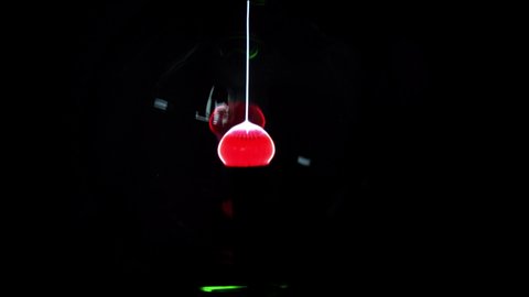 Plasma ball, Tesla lamp, Plasma globe with high voltage lightning. Coil experiment with electricity. Plasma lightning ball. Discharge lamp. Inert gas discharge tube.