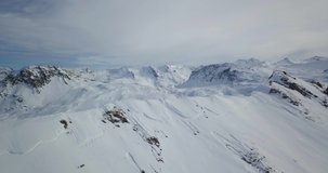 Amazing Aerial view of Ski Tin Resort French Alps Mountains covered in snow.