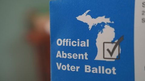 Detroit, MI - Circa 2020: Official Absentee Mail in Ballot Beauty shot of Envelope in Michigan Swing State, voter awareness and engagement piece, stay at home order vote, absent voter