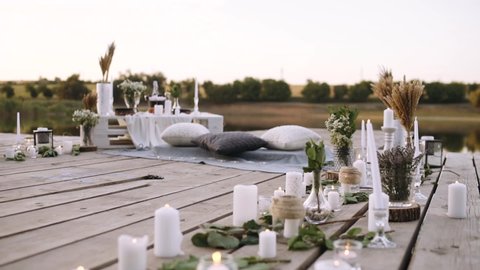 Romantic decor elements for marriage requests. Romantic outdoor dinner. Composition with candle decoration. Concept of marriage applications.