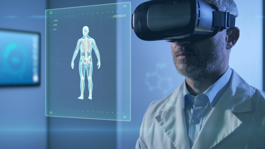 medical science new technology,male doctor using vr glasses virtual reality working on 3d human body parts,innovative scientist in laboratory room checking cyber charts graphics using ai Royalty-Free Stock Footage #1060685308